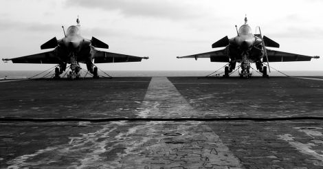 Two Dassault Rafale multi-role fighter jets aboard France's only aircraft carrier R91 Charles de Gaulle. Image Credit: CC by Pascal Subtil/Flickr.